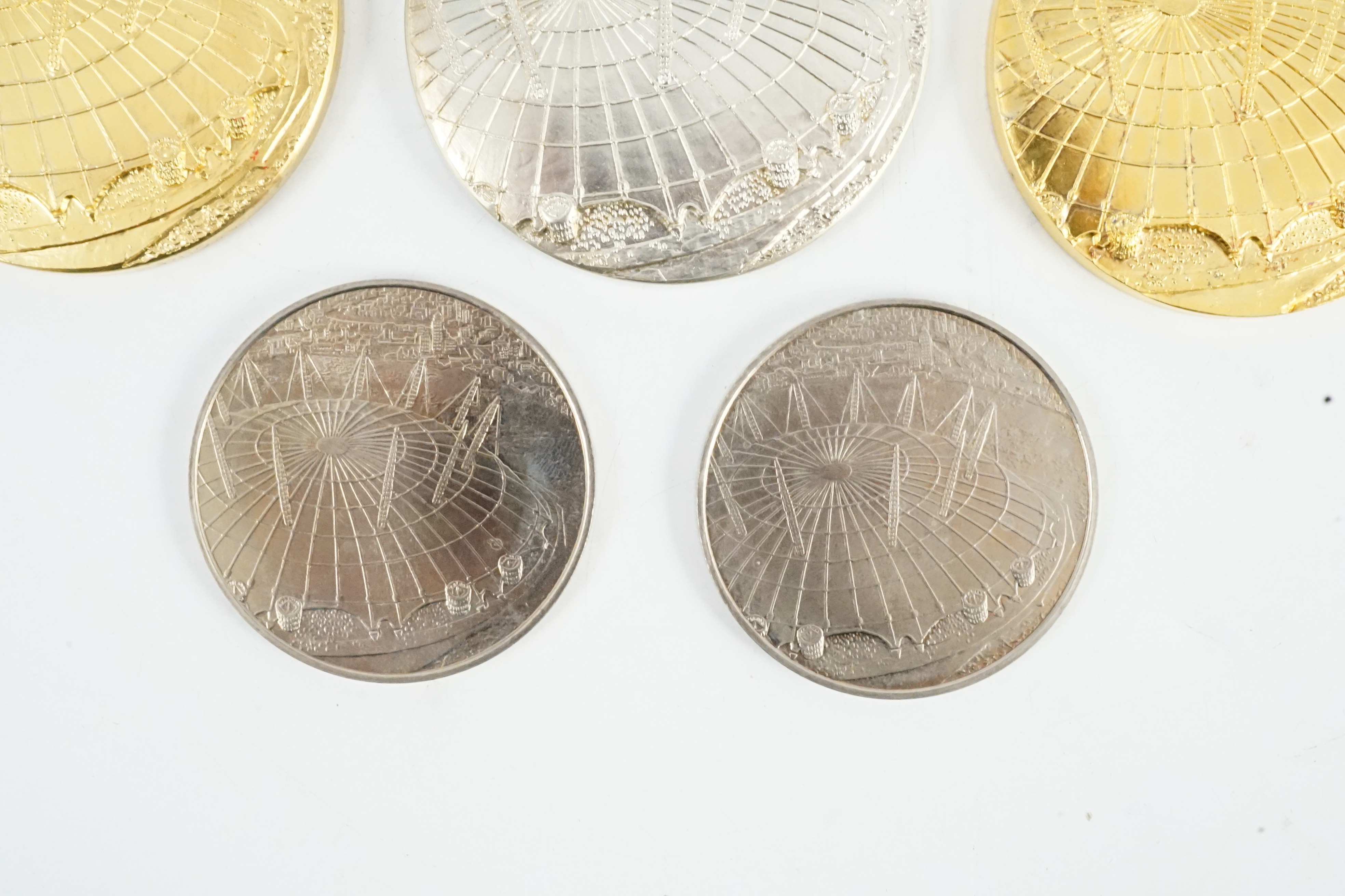 Jacqueline Stieger (b.1936) for Royal Mint, two prototype silver-gilt (Millennium) Dome medals, and a similar first strike silver medal